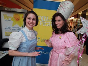 Amy Cooper, left, playing Dorothy and Wendy German as Good Witch Glinda were on hand for the launch of Yellow Brick Road to Life, a fundraising campaign for Canadian Cancer Society at Devonshire Mall March 13, 2014. (NICK BRANCACCIO/The Windsor Star)