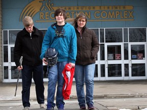 Josh Bluhm, centre, has quit his Southpoint hockey team due to alleged bullying incidents and has received support from teammate Justin Church, left, and his mother Wendy Bluhm, March 14, 2014. (NICK BRANCACCIO/The Windsor Star)