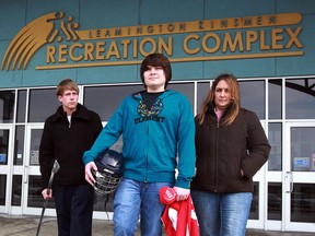 Josh Bluhm, centre, has quit his Southpoint hockey team due to alleged bullying incidents and has received support from teammate Justin Church, left, and his mother Wendy Bluhm March 14, 2014. (NICK BRANCACCIO/The Windsor Star)