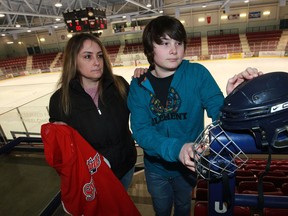 Josh Bluhm, centre, has quit his Southpoint hockey team due to alleged bullying incidents and has received support from a teammate Justin Church, and his mother Wendy Bluhm March 14, 2014. (NICK BRANCACCIO/The Windsor Star)