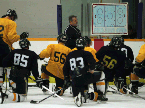 University of Windsor men's hockey head coach Kevin Hamlin, centre, instructs his team during practice at South Windsor Arena. (DAX MELMER/The Windsor Star)