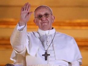 Newly elected Pope Francis I waves to the waiting crowd from the central balcony of St Peter's Basilica on March 13, 2013 in Vatican City, Vatican. l(Photo by Peter Macdiarmid/Getty Images)