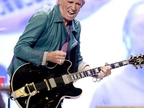 Keith Richards, shown onstage with The Rolling Stones in California, May 15, 2013, has written a children's book. (Getty Images files)