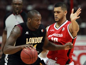 Windsor Express Kevin Loiselle guards London Lightning Jermaine Johnson in playoff basketball action from WFCU Centre Monday March 17, 2014. (NICK BRANCACCIO/The Windsor Star)
