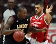 Windsor Express Kevin Loiselle guards London Lightning Jermaine Johnson in playoff basketball action from WFCU Centre Monday March 17, 2014. (NICK BRANCACCIO/The Windsor Star)