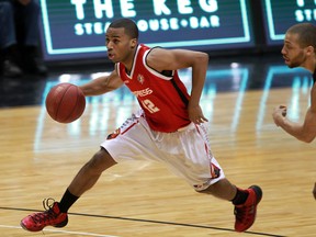 Windsor Express Darren Duncan moves the ball against London Lightning in playoff basketball action from WFCU Centre Monday March 17, 2014. (NICK BRANCACCIO/The Windsor Star)