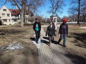 Walkerville High School students William MacLean, left, Alexandria Faubert, John Kribs and Jake Kribs, right, use paved paths at Willistead Park while on a break from classes Monday March 17, 2014. (NICK BRANCACCIO/The Windsor Star)