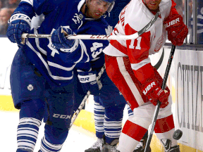 Toronto's Nazem Kadri, left, is checked by Detroit's Daniel Alfredsson at the Air Canada Centre. (Photo by Abelimages/Getty Images)