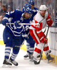 Toronto's Nazem Kadri, left, is checked by Detroit's Daniel Alfredsson at the Air Canada Centre. (Photo by Abelimages/Getty Images)