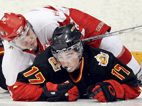 Tecumseh's Garrett Wilson, below, is checked by Leamington's Ryan Federman at Tecumseh Arena in 2008. (TYLER BROWNBRIDGE/The Windsor Star)