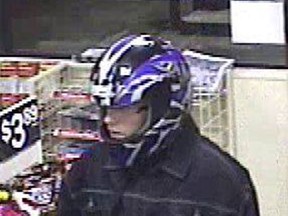 Police handout photo of helmet-wearing robber who threatened a 7-11 clerk with a broken beer bottle.