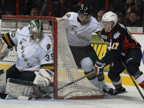 Windsor's Ben Johnson, right, is stopped by London goalie Jake Patterson and Zach Bell  at the WFCU Centre. (DAN JANISSE/The Windsor Star)