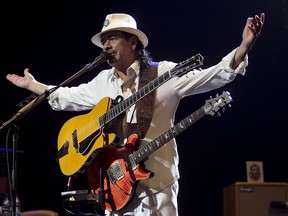 Carlos Santana performs at the Bell Centre in Montreal in this July 15, 2010 file photo. ( Phil Carpenter / MONTREAL GAZETTE)