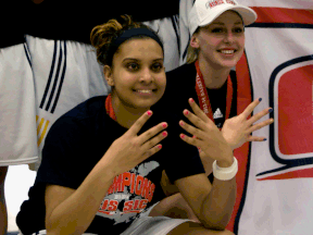 University of Windsor's Miah-Marie Langlois, left, poses with the team after winning the CIS basketball title at the St. Denis Centre. (JOEL BOYCE/The Windsor Star)