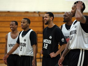 Windsor Express Stefan Bonneau, left, Darren Duncan, R.J. Wells, Quinnel Brown and George Goode, right, smile near the end of practice at Rose City Islamic Centre Monday March 3, 2014. (NICK BRANCACCIO/The Windsor Star)