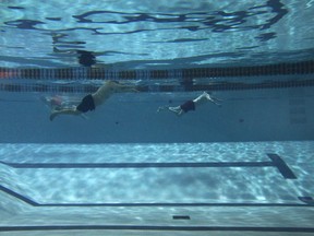 Swimmers are shown in the YMCA pool in downtown Windsor, Ont. on Wednesday, March 26, 2014. The pool will close in about a month. (DAN JANISSE/The Windsor Star)