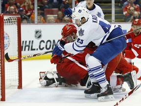 Toronto Maple Leafs center Nazem Kadri (43) shoots into the net against the Detroit Red Wings in the third period of an NHL hockey game in Detroit, Tuesday, March 18, 2014. The goal was waived off. (AP Photo/Paul Sancya)