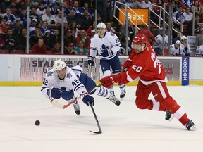 Tyler Bozak #42 of the Toronto Maple Leafs dives to block the shot of Drew Miller #20 of the Detroit Red Wings during the first period of the game at Joe Louis Arena on March 18, 2014 in Detroit, Michigan. (Photo by Leon Halip/Getty Images)