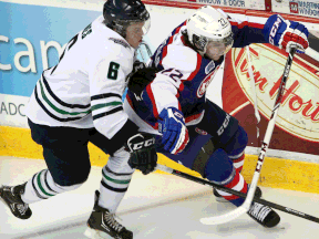 Plymouth's Mitch Jones, left, battles with Windsor's Sam Povorozniouk at the WFCU Centre. (NICK BRANCACCIO/The Windsor Star)