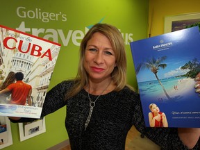 Sarah Hupalo of Goliger's Travel Plus says vacationers just want to go someplace warm Thursday March 20, 2014. Hupalo hasn't noticed any change in business now that the Canadian dollar has dropped below $0.90 U.S.  (NICK BRANCACCIO/The Windsor Star)