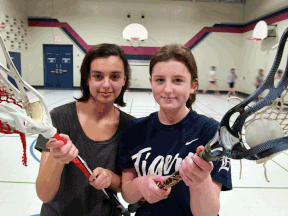 Storm Meness, left, and Jaime Land are members of a new girls lacrosse team. (NICK BRANCACCIO/The Windsor Star)