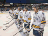 Lancers captain Drew Palmer, from right, Evan Stibbard and Spencer Pommells look on during player of the game awards after being defeated by the Saskatchewan Huskies 9-0 at the CIS University Cup hockey semifinal in Saskatoon Saturday. (THE CANADIAN PRESS/Liam Richards)