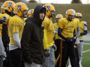 Windsor receiver Evan Pszconak, centre, looks on during a spring training session at Alumni Field Monday. (TYLER BROWNBRIDGE/The Windsor Star)