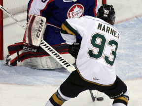 Windsor's Dalen Kuchmey, left, makes a save on London's Mitchell Marner at the WFCU Centre. (TYLER BROWNBRIDGE/The Windsor Star)