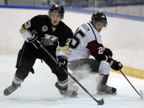 LaSalle's Andrews Burns, left, steals the puck from Chatham's Michael Verboom at the Vollmer Centre. (TYLER BROWNBRIDGE/The Windsor Star)