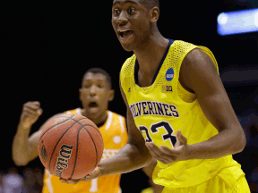 Michigan's Caris LeVert, right, reacts to a call during the second half of an NCAA Midwest Regional semifinal against Tennessee. (AP Photo/David J. Phillip)