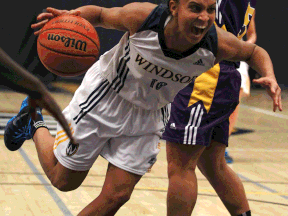 Windsor's Miah-Marie Langlois, left, drives to the basket against Laurier at the St. Denis Centre. (DAX MELMER/The Windsor Star)