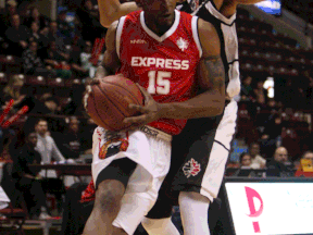 Windsor's Quinnel Brown, left, collides with Mississauga's  Morgan Lewis at the WFCU Centre. (TYLER BROWNBRIDGE/The Windsor Star)