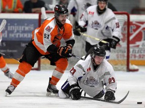 Dylan Solecki, left, of the Essex 73's takes down the Dorchester's Tommy Prokes at the Essex Centre Sports Complex in Essex on Friday, March 28, 2014. (TYLER BROWNBRIDGE/The Windsor Star)