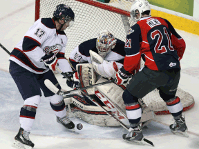 Windsor's Brody Milne, right, waits for a rebound in front of Saginaw,'s Kristoff Kontos, left, and goaltender Jake Paterson at the WFCU Centre Thursday. (TYLER BROWNBRIDGE/The Windsor Star)