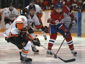 Belle River's Branden Larocque, right, is checked by Chad Hendrick of the 73's Friday at Lakeshore Arena, (DAX MELMER/The Windsor Star)