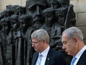 Prime Minister Stephen Harper, left, stands with Israeli Prime Minister Benjamin Netanyahu after signing the guest book at the Yad Vashem Holocaust Memorial in Jerusalem, on Tuesday, Jan. 21, 2014. Harper, a staunch Israeli ally, is on a four-day visit. (AP Photo/The Canadian Press, Sean Kilpatrick)