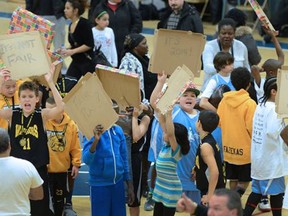 Atom basketball players from Windsor hold a protest for being disqualified in the gold medal game of the Blessed Sacrament basketball tournament at Cathedral High School Sunday. (Scott Gardiner/The Hamilton Spectator)