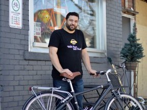Co-owner of Windsor Eats Adriano Ciotoli poses with his bicycle March 10, 2014 outside of City Cyclery which will host the Windsor Launch of the North American Bicycle Week March 27, 2014. (RICHARD RIOSA/Special to the Star)