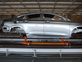 A 2015 Chrysler 200 sits on the assembly line in the paint shop at the Sterling Heights Assembly Plant, Friday, March 14, 2014.  (DAX MELMER/The Windsor Star)