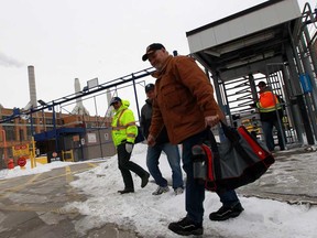 Chrysler workers leave the Windsor Assembly Plant from the Ypres gate Tuesday March 4, 2014. (NICK BRANCACCIO/The Windsor Star)