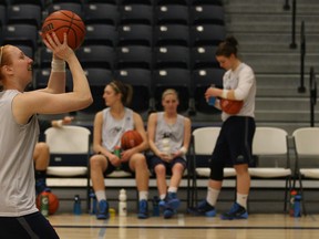 Emily Prevost practices her foul shot during a media availability for the University of Windsor's women's basketball team at the St. Denis Centre, Tuesday, March 11, 2014.  Windsor is hosting this year's CIS women's basketball championships March 14-16.  (DAX MELMER/The Windsor Star)