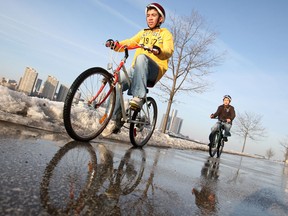 Young boys enjoy the milder weather as they ride their bikes along the Windsor waterfront, Monday, March 10, 2014.  (DAX MELMER/The Windsor Star)