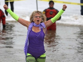 Linda Lymaa participates in The Polar Bear Dip at Cedar Island Beach in Kingsville, Saturday, March 22, 2014.  Lymaa was taking part in honour of Aubri Andre, a seven-year-old girl battling a rare form of Leukemia.  Funds raised from the event go to ChildCan and Access County Community Support Services.  (DAX MELMER/The Windsor Star)