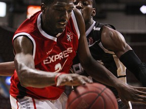 The Windsor Express' Chris Commons collides with the Mississauga Power's Kirk Williams Jr. at the WFCU Centre in Windsor on Tuesday, March 4, 2014. The Express defeated the Power 105-97.                     (TYLER BROWNBRIDGE/The Windsor Star)