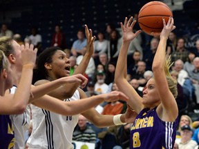 Wilfrid Laurier Golden Hawks Courtney Bruce battles for rebound with University of Windsor Lancers Cheyanne Roger in CIS Women's Basketball Final 8 action from St Denis Centre March 14, 2014. (NICK BRANCACCIO/The Windsor Star)