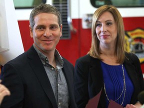 Mike and Muffy Sleiman are shown Monday, March 3, 2014, at the Windsor Fire and Rescue Services downtown headquarters. The couple received civilian citations from the department for their efforts in assisting Pat Malicki escape a house fire. (DAN JANISSE/The Windsor Star)