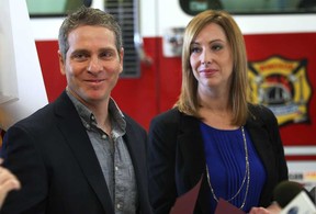 Mike and Muffy Sleiman are shown Monday, March 3, 2014, at the Windsor Fire and Rescue Services downtown headquarters. The couple received civilian citations from the department for their efforts in assisting Pat Malicki escape a house fire. (DAN JANISSE/The Windsor Star)