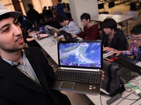 Emmanuel Yousif, a game supervisor, describes the increasingly popular world of computer gaming at the ninth annual No Man's LAN  tournament held at St. Clair College over the weekend. (DAX MELMER/ The Windsor Star)