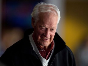 Hockey great Gordie Howe watches the Vancouver Canucks and San Jose Sharks play during a hockey game in Vancouver on  November 14, 2013. (Darryl Dyck/The Canadian Press)