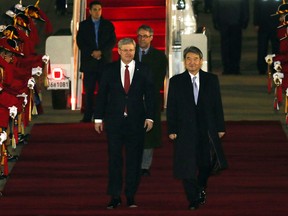 Canadian Prime Minister Stephen Harper, left, is escorted by South Korea's 1st Vice Foreign Minister Cho Tae-yong upon his arrival at Seoul military airport in Seongnam, South Korea, Monday, March 10, 2014. Harper will meet with South Korean President Park Geun-hye to boost bilateral cooperation on Tuesday. (AP Photo/Choi Jae-gu, Yonhap)